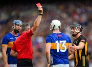 6 July 2025; Darragh McCarthy of Tipperary is comforted by Mikey Butler of Kilkenny, right, as he is shown a red card, a second yellow, by referee James Owens during the GAA Hurling All-Ireland Senior Championship semi-final match between Kilkenny and Tipperary at Croke Park in Dublin. Photo by Ray McManus/Sportsfile