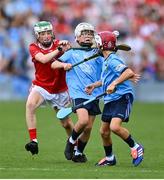 5 July 2025; Harry Doyle, The Downs N.S, The Downs, Westmeath, representing Dublin in action against Cillian Cunningham, Dernakesh N.S, Cootehill, Cavan, representing Cork during the GAA INTO Cumann na mBunscol Respect Exhibition Go Games match at the GAA Hurling All-Ireland Senior Championship semi-final match between Cork and Dublin at Croke Park in Dublin. Photo by David Fitzgerald/Sportsfile