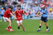 5 July 2025; Ruadhán Carter, St Kevin’s N.S, Philipstown, Dunleer, Louth, representing Dublin in action against Gerard Connor, Scoil Mhuire na mBuachaillí, Castlebayney, Monaghan, representing Cork during the GAA INTO Cumann na mBunscol Respect Exhibition Go Games match at the GAA Hurling All-Ireland Senior Championship semi-final match between Cork and Dublin at Croke Park in Dublin. Photo by David Fitzgerald/Sportsfile