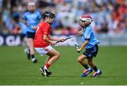 5 July 2025; Ruadhán Carter, St Kevin’s N.S, Philipstown, Dunleer, Louth, representing Dublin in action against Gerard Connor, Scoil Mhuire na mBuachaillí, Castlebayney, Monaghan, representing Cork during the GAA INTO Cumann na mBunscol Respect Exhibition Go Games match at the GAA Hurling All-Ireland Senior Championship semi-final match between Cork and Dublin at Croke Park in Dublin. Photo by David Fitzgerald/Sportsfile