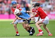 5 July 2025; Harry Doyle, The Downs N.S, The Downs, Westmeath, representing Dublin in action against Davin Finn, St Ciarán’s N.S, Moore, Roscommon, representing Cork during the GAA INTO Cumann na mBunscol Respect Exhibition Go Games match at the GAA Hurling All-Ireland Senior Championship semi-final match between Cork and Dublin at Croke Park in Dublin. Photo by David Fitzgerald/Sportsfile