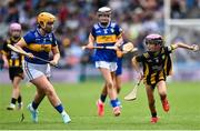 6 July 2025; Molly Mí Raghallaigh, Gaelscoil Uí Fhiaich, Maigh Nuad, Cill Dara, representing Kilkenny in action against Ella McDaid, St Aengus NS, Brigend, Donegal, representing Tipperary during the GAA INTO Cumann na mBunscol Respect Exhibition Go Games match at the GAA Hurling All-Ireland Senior Championship semi-final match between Kilkenny and Tipperary at Croke Park in Dublin. Photo by David Fitzgerald/Sportsfile