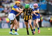 6 July 2025; Eilís Ní Ruagáin, Gaelscoil Phortlaoise, Portlaoise, Louth, representing Kilkenny in action against Ella McDaid, St Aengus NS, Brigend, Donegal, representing Tipperary during the GAA INTO Cumann na mBunscol Respect Exhibition Go Games match at the GAA Hurling All-Ireland Senior Championship semi-final match between Kilkenny and Tipperary at Croke Park in Dublin. Photo by David Fitzgerald/Sportsfile