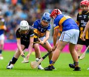 6 July 2025; Michael O'Callaghan, Carraroe NS, Carraroe, Sligo, representing Kilkenny, in action against Seán Allen, St Joseph's PS, Dungannon, Tyrone, representing Tipperary and Seán Allen, St Joseph's PS, Dungannon, Tyrone, representing Tipperary, during the GAA INTO Cumann na mBunscol Respect Exhibition Go Games match at the GAA Hurling All-Ireland Senior Championship semi-final match between Kilkenny and Tipperary at Croke Park in Dublin. Photo by Ray McManus/Sportsfile