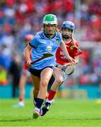 5 July 2025; Lainey O'Leary, Barntown N.S, Barntown, Wexford in action against Ella Hartnett, Tineteriffe N.S, Cappamore, Limerick, representing Cork, during the GAA INTO Cumann na mBunscol Respect Exhibition Go Games match at the GAA Hurling All-Ireland Senior Championship semi-final match between Cork and Dublin at Croke Park in Dublin. Photo by Ray McManus/Sportsfile
