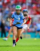 5 July 2025; Lainey O'Leary, Barntown N.S, Barntown, Wexford in action against Ella Hartnett, Tineteriffe N.S, Cappamore, Limerick, representing Cork, during the GAA INTO Cumann na mBunscol Respect Exhibition Go Games match at the GAA Hurling All-Ireland Senior Championship semi-final match between Cork and Dublin at Croke Park in Dublin. Photo by Ray McManus/Sportsfile