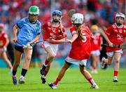 5 July 2025; Lainey O'Leary, Barntown N.S, Barntown, Wexford in action against Ella Hartnett, Tineteriffe N.S, Cappamore, Limerick, representing Cork, during the GAA INTO Cumann na mBunscol Respect Exhibition Go Games match at the GAA Hurling All-Ireland Senior Championship semi-final match between Cork and Dublin at Croke Park in Dublin. Photo by Ray McManus/Sportsfile