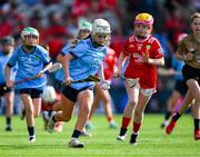 5 July 2025; Kirsty Hynes, Coolderry Central School, Coolderry, Offaly, representing Dublin, in action against Orla McGrogan, Millquarter P.S, Toome, Antrim, representing Cork, during the GAA INTO Cumann na mBunscol Respect Exhibition Go Games match at the GAA Hurling All-Ireland Senior Championship semi-final match between Cork and Dublin at Croke Park in Dublin. Photo by Ray McManus/Sportsfile