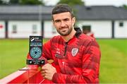 9 July 2025; Michael Duffy of Derry City poses for a portrait with his SSE Airtricity / SWI Player of the Month Award for June 2025 at Dungiven in Derry. Photo by Oliver McVeigh/Sportsfile