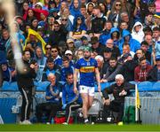 6 July 2025; Darragh Stakelum of Tipperary awaits a call to be introduced as a second half substitute during the GAA Hurling All-Ireland Senior Championship semi-final match between Kilkenny and Tipperary at Croke Park in Dublin. Photo by Ray McManus/Sportsfile