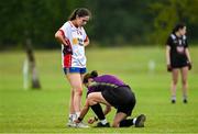 8 July 2025; Tyrone player Caoimhe McCullogh has her lace tied by referee Sinead McHugh during the LGFA U17 Player Development Day at Portlaoise GAA club in Portlaoise, Laois. Photo by Stephen Marken/Sportsfile