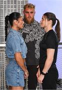 8 July 2025; Katie Taylor, right, and Amanda Serrano face-off on the staircase, with Jake Paul, co-Founder of Most Valuable Promotions, during a lighting up of the Empire State Building, in New York, USA, to kick off Taylor v Serrano 3 fight week ahead of their undisputed super lightweight championship fight that will take place at Madison Square Garden in New York on Friday, 11th July. Additionally, in honor of the historic trilogy fight, the Empire State Building will shine its world-famous tower lights in the colors of Taylor’s and Serrano’s homelands – green, white and orange to represent the Irish flag and blue, white and red to represent the Puerto Rican flag – on fight night. Photo by Stephen McCarthy/Sportsfile