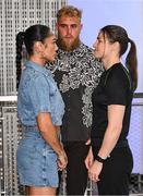 8 July 2025; Katie Taylor, right, and Amanda Serrano face-off on the staircase, with Jake Paul, co-Founder of Most Valuable Promotions, during a lighting up of the Empire State Building, in New York, USA, to kick off Taylor v Serrano 3 fight week ahead of their undisputed super lightweight championship fight that will take place at Madison Square Garden in New York on Friday, 11th July. Additionally, in honor of the historic trilogy fight, the Empire State Building will shine its world-famous tower lights in the colors of Taylor’s and Serrano’s homelands – green, white and orange to represent the Irish flag and blue, white and red to represent the Puerto Rican flag – on fight night. Photo by Stephen McCarthy/Sportsfile
