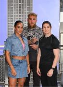 8 July 2025; Katie Taylor, right, and Amanda Serrano square-off on the staircase, with Jake Paul, co-Founder of Most Valuable Promotions, during a lighting up of the Empire State Building, in New York, USA, to kick off Taylor v Serrano 3 fight week ahead of their undisputed super lightweight championship fight that will take place at Madison Square Garden in New York on Friday, 11th July. Additionally, in honor of the historic trilogy fight, the Empire State Building will shine its world-famous tower lights in the colors of Taylor’s and Serrano’s homelands – green, white and orange to represent the Irish flag and blue, white and red to represent the Puerto Rican flag – on fight night. Photo by Stephen McCarthy/Sportsfile