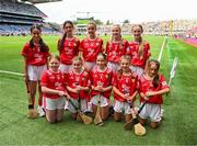 5 July 2025; The Cork team pose for a group photo, back row, left to right, Ayanah Fitzpatrick, GS Liatroma, Cora Droma Ruisc, Leitrim, Annie Hegarty, Kilnamona N.S, Ennis, Clare, Sophie Mooney, Ogonnelloe N.S, Scariff, Clare, Ella Hartnett, Tineteriffe N.S, Cappamore, Limerick, and Emma Maher, Scoil Éanna, Loughrea, Galway, front row, Orla McGrogan, Millquarter P.S, Toome, Antrim, Cuisle Gillen, Bunscoil an tSléibhe Dhuibh, Béal Feirste, Antrim, Kate Ryan, Scoil Fhionain, Kilfinane, Limerick, Aoibheann Burke, Cregmore N.S, Claregalway, Galway, and Shannon Kenny, GS Uileog de Búrca, Clár Chlainne Mhuiris, Mayo, before the GAA INTO Cumann na mBunscol Respect Exhibition Go Games at the GAA Hurling All-Ireland Senior Championship semi-final match between Cork and Dublin at Croke Park in Dublin. Photo by Ray McManus/Sportsfile