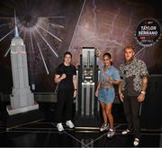 8 July 2025; Katie Taylor, left, and Amanda Serrano with Jake Paul, co-Founder of Most Valuable Promotions, during a lighting up of the Empire State Building, in New York, USA, to kick off Taylor v Serrano 3 fight week ahead of their undisputed super lightweight championship fight that will take place at Madison Square Garden in New York on Friday, 11th July. Additionally, in honor of the historic trilogy fight, the Empire State Building will shine its world-famous tower lights in the colors of Taylor’s and Serrano’s homelands – green, white and orange to represent the Irish flag and blue, white and red to represent the Puerto Rican flag – on fight night. Photo by Stephen McCarthy/Sportsfile