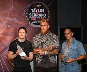 8 July 2025; Katie Taylor, left, and Amanda Serrano with Jake Paul, co-Founder of Most Valuable Promotions, during a lighting up of the Empire State Building, in New York, USA, to kick off Taylor v Serrano 3 fight week ahead of their undisputed super lightweight championship fight that will take place at Madison Square Garden in New York on Friday, 11th July. Additionally, in honor of the historic trilogy fight, the Empire State Building will shine its world-famous tower lights in the colors of Taylor’s and Serrano’s homelands – green, white and orange to represent the Irish flag and blue, white and red to represent the Puerto Rican flag – on fight night. Photo by Stephen McCarthy/Sportsfile