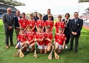 5 July 2025; The Cork team pose for a group photo with Uachtarán Chumann Lúthchleas Gael Jarlath Burns, Uachtarán of the Camogie Association, Brian Molloy, Head of the Hurling Development Committee, Terry Reilly, GAA National Head of Hurling William Maher, Anne Horan, President, INTO, and Gary Farrell, President, Cumann na mBunscol with players, back row, left to right, Cillian Cunningham, Dernakesh N.S, Cootehill, Cavan, Gerard Connor, Scoil Mhuire na mBuachaillí, Castlebayney, Monaghan, Oisín Rice, Scoil Mhuire, Latton, Monaghan, Davin Finn, St Ciarán’s N.S, Moore, Roscommon, and Finnian O’Connor, Cliffoney N.S, Cliffoney, Sligo, front row, Cian Connell, St Mary’s N.S, Edgeworthstown, Longford, Joshua Hill, St Ronan’s P.S, Lisnaskea, Fermanagh, Connla Gilligan, Scoil An Choimín, Cloghan, Donegal, Robbie Mallon, St Mary’s Ballygunner, Waterford City, Waterford, and Tommy Houlihan, Bunscoil Bhothar na Naomh, Lismore, Waterford, before the GAA INTO Cumann na mBunscol Respect Exhibition Go Games at the GAA Hurling All-Ireland Senior Championship semi-final match between Cork and Dublin at Croke Park in Dublin. Photo by Ray McManus/Sportsfile
