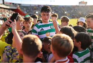 8 July 2025; Colby Donovan of Celtic is surrounded by supporters after the Cork Super Cup match between Cork City and Celtic FC at SuperValu Páirc Uí Chaoimh in Cork. Photo by Thomas Flinkow/Sportsfile