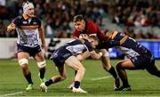 9 July 2025; Garry Ringrose of British & Irish Lions is tackled by ACT Brumbies players Ryan Lonergan, left, and Lington Ieli during the tour match between ACT Brumbies and the British & Irish Lions at GIO Stadium in Canberra, Australia. Photo by Steve Christo/Sportsfile
