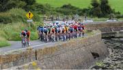 9 July 2025; A general view of the peloton during Stage 2 of 2025 Junior Tour of Ireland from Ennis to Kilkee. Photo by Stephen McMahon/Sportsfile