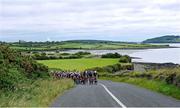 9 July 2025; A general view of the peloton during Stage 2 of 2025 Junior Tour of Ireland from Ennis to Kilkee. Photo by Stephen McMahon/Sportsfile
