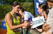 9 July 2025; Nicola Tuthill of Ireland signs autographs for supporters after competing in the Inspire (Credit Union) Women's Hammer during the Cork City Sports meet at MTU Arena in Cork. Photo by Sam Barnes/Sportsfile