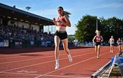 9 July 2025; Faye Mannion of Ennis Track Club on her way to winning the MTU Junior Women's 800m during the Cork City Sports meet at MTU Arena in Cork. Photo by Sam Barnes/Sportsfile