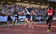 9 July 2025; Coby Hilton of USA, centre, finishes in first place ahead of Israel Olatunde of Ireland, right, who finished second, in the SuperValu Men's 100m Race 2 during the Cork City Sports meet at MTU Arena in Cork. Photo by Sam Barnes/Sportsfile