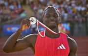 9 July 2025; Israel Olatunde of Ireland celebrates with his silver medal after finishing second in the SuperValu Men's 100m Race 2 during the Cork City Sports meet at MTU Arena in Cork. Photo by Sam Barnes/Sportsfile Photo by Sam Barnes/Sportsfile
