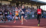 9 July 2025; Coby Hilton of USA, centre, finishes in first place ahead of Israel Olatunde of Ireland, right, who finished second, in the SuperValu Men's 100m Race 2 during the Cork City Sports meet at MTU Arena in Cork. Photo by Sam Barnes/Sportsfile