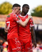 9 July 2025; Mipo Odubeko of Shelbourne, right, celebrates with teammate Daniel Kelly after scoring their side's first goal during the UEFA Champions League First Qualifying Round first leg match between Shelbourne and Linfield at Tolka Park in Dublin. Photo by Ben McShane/Sportsfile