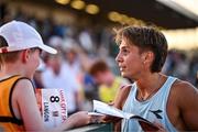 9 July 2025; Marco Langon of USA gives his race number to a supporter after winning the Cork City Council Men's Mile during the Cork City Sports meet at MTU Arena in Cork. Photo by Sam Barnes/Sportsfile