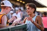 9 July 2025; Marco Langon of USA signs autographs for supporters after winning the Cork City Council Men's Mile during the Cork City Sports meet at MTU Arena in Cork. Photo by Sam Barnes/Sportsfile