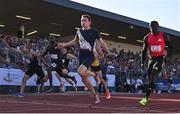9 July 2025; Coby Hilton of USA, centre, finishes in first place ahead of Israel Olatunde of Ireland, right, who finished second, in the SuperValu Men's 100m Race 2 during the Cork City Sports meet at MTU Arena in Cork. Photo by Sam Barnes/Sportsfile