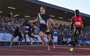 9 July 2025; Coby Hilton of USA, centre, finishes in first place ahead of Israel Olatunde of Ireland, right, who finished second, in the SuperValu Men's 100m Race 2 during the Cork City Sports meet at MTU Arena in Cork. Photo by Sam Barnes/Sportsfile