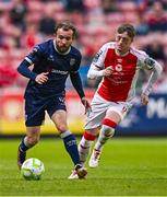 23 June 2025; Paul McMullan of Derry City and Chris Forrester of St Patrick's Athletic during the SSE Airtricity Men's Premier Division match between St Patrick's Athletic and Derry City at Richmond Park in Dublin. Photo by Ben McShane/Sportsfile