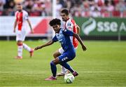 10 July 2025; Carlos Duke of FC Hegelmann in action against Zach Elbouzedi of St Patrick's Athletic during the UEFA Conference League First Qualifying Round first leg match between St Patrick's Athletic and FC Hegelmann at Richmond Park in Dublin. Photo by Ben McShane/Sportsfile