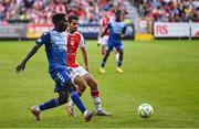10 July 2025; Abdoul Samad Harouna of FC Hegelmann in action against Zach Elbouzedi of St Patrick's Athletic during the UEFA Conference League First Qualifying Round first leg match between St Patrick's Athletic and FC Hegelmann at Richmond Park in Dublin. Photo by Ben McShane/Sportsfile