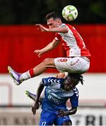 10 July 2025; Mason Melia of St Patrick's Athletic in action against Abdoul Samad Harouna of FC Hegelmann during the UEFA Conference League First Qualifying Round first leg match between St Patrick's Athletic and FC Hegelmann at Richmond Park in Dublin. Photo by Ben McShane/Sportsfile