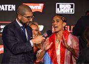 10 July 2025; Amanda Serrano with host Ariel Helwani during weigh-ins, held at The Theater at Madison Square Garden in New York, USA, ahead of her undisputed super lightweight championship fight with Katie Taylor on July 11th at Madison Square Garden in New York. Photo by Stephen McCarthy/Sportsfile