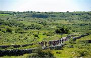 11 July 2025; A general view of the peloton during Stage 4 of 2025 Junior Tour of Ireland from Ennis to Kilfenora. Photo by Stephen McMahon/Sportsfile