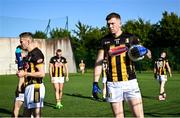 11 July 2025; Walter Walsh of Kilkenny warming up with team-mates on the hurling wall astro turf pitch before the GAA Football All-Ireland Junior Championship semi-final match between London and Kilkenny at the GAA National Centre of Excellence in Abbotstown, Dublin. Photo by Piaras Ó Mídheach/Sportsfile