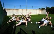 11 July 2025; Kilkenny players warming up with team-mates on the hurling wall astro turf pitch before the GAA Football All-Ireland Junior Championship semi-final match between London and Kilkenny at the GAA National Centre of Excellence in Abbotstown, Dublin. Photo by Piaras Ó Mídheach/Sportsfile