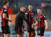 11 July 2025; Bohemians manager Alan Reynolds with players Douglas James Taylor, centre, and Ross Tierney after their side's victory in the SSE Airtricity Men's Premier Division match between Bohemians and Galway United at Dalymount Park in Dublin. Photo by Thomas Flinkow/Sportsfile