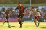 11 July 2025; Douglas James Taylor of Bohemians in action against Greg Cunningham of Galway United during the SSE Airtricity Men's Premier Division match between Bohemians and Galway United at Dalymount Park in Dublin. Photo by Thomas Flinkow/Sportsfile
