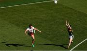 12 July 2025; Darragh Canavan of Tyrone kicks a two-point score under pressure from Paul Murphy of Kerry during the GAA Football All-Ireland Senior Championship semi-final match between Kerry and Tyrone at Croke Park in Dublin. Photo by Ramsey Cardy/Sportsfile