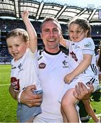 12 July 2025; Kildare manager Brian Flanagan celebrates with his children Tadhg, age three, and Amelia, age four, after the Tailteann Cup final match between Kildare and Limerick at Croke Park in Dublin. Photo by Seb Daly/Sportsfile
