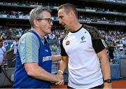 12 July 2025; Kildare manager Brian Flanagan, right, and Limerick manager Jimmy Lee shake hands after the Tailteann Cup final match between Kildare and Limerick at Croke Park in Dublin. Photo by Seb Daly/Sportsfile