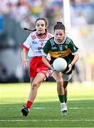 12 July 2025; Ava Deacon, Kildavin National School, Kildavin, Carlow, representing Kerry, and Ava Owens, St Mary's Primary School, Teemore, Fermanagh, representing Tyrone, during the GAA INTO Cumann na mBunscol Respect Exhibition Go Games match at the GAA Football All-Ireland Senior Championship semi-final match between Kerry and Tyrone at Croke Park in Dublin. Photo by Seb Daly/Sportsfile